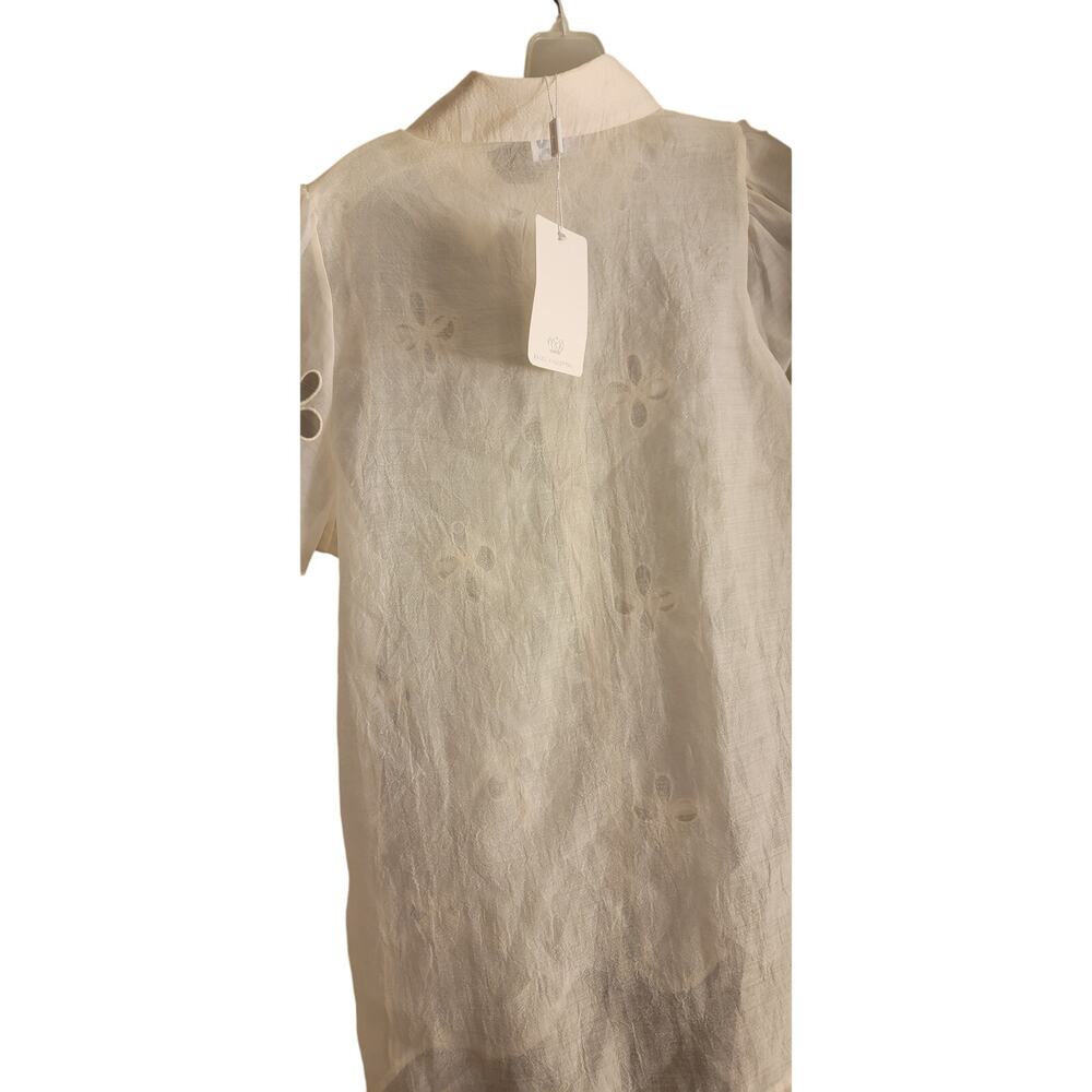 Muy Muy  cream colored bow blouse